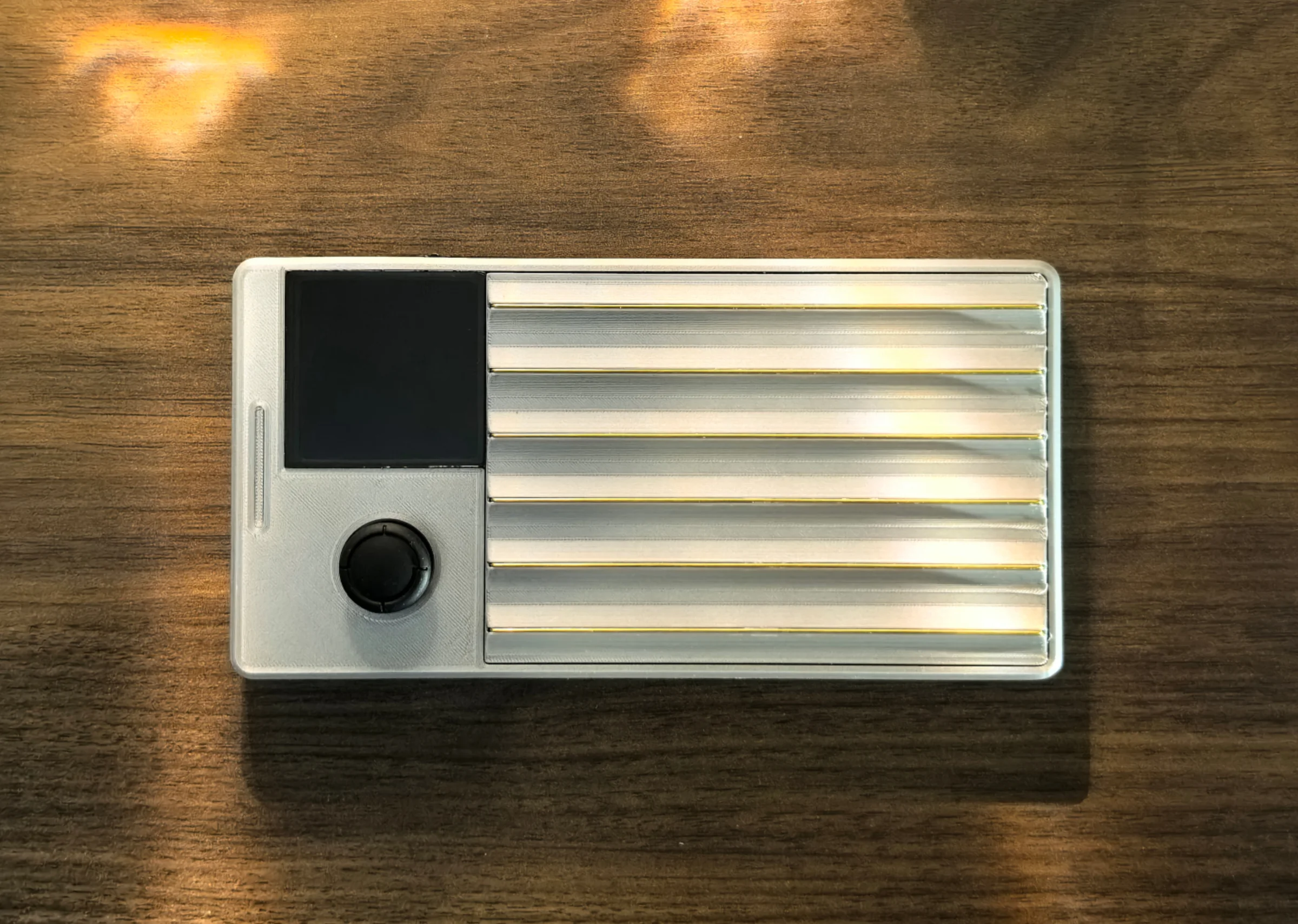 Pocket Guitar on a wooden table